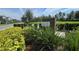 A community entrance sign surrounded by lush greenery offers a welcoming feel at 12009 Walmsley Aly, Winter Garden, FL 34787