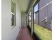 A long, shaded patio with red brick flooring is a delightful spot to relax and enjoy the outdoors at 12009 Walmsley Aly, Winter Garden, FL 34787