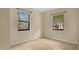 Bedroom featuring tile floors, neutral walls, and two windows for natural light at 1202 Randolph St, Sanford, FL 32771