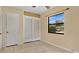 Bedroom with tile floors and a large window offering natural light and neighborhood views at 1202 Randolph St, Sanford, FL 32771