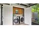 Enclosed laundry area with modern washer and dryer units, offering convenience and functionality at 1202 Randolph St, Sanford, FL 32771
