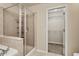 Bathroom featuring a glass enclosed shower and walk in closet at 1227 Juniper Hammock St, Winter Garden, FL 34787
