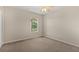 This carpeted bedroom is spacious and has a ceiling fan for added comfort at 1227 Juniper Hammock St, Winter Garden, FL 34787