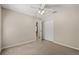 Neutral bedroom with carpet flooring featuring a ceiling fan and closet at 1227 Juniper Hammock St, Winter Garden, FL 34787