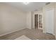 Neutral bedroom with closet, glass paneled door, and plush carpeting at 1227 Juniper Hammock St, Winter Garden, FL 34787