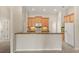 Open-concept kitchen featuring stainless steel appliances, a breakfast bar, and easy access to the rest of the house at 1227 Juniper Hammock St, Winter Garden, FL 34787