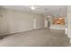 Open-concept living room with a ceiling fan and easy access to kitchen and other areas at 1227 Juniper Hammock St, Winter Garden, FL 34787