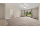 Bright and spacious living room featuring a ceiling fan, sliding glass doors, and access to the outdoor area at 1227 Juniper Hammock St, Winter Garden, FL 34787
