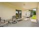 Covered patio with table and chairs at 1227 Juniper Hammock St, Winter Garden, FL 34787