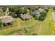 Lush rear yard with mature trees and open space near a picturesque pond at 1227 Juniper Hammock St, Winter Garden, FL 34787