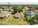 Spacious backyard view of home with solar panels and lush green trees at 1227 Juniper Hammock St, Winter Garden, FL 34787