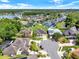 Aerial view of the neighborhood showcasing well-maintained homes, mature trees, and ponds, with the home nestled in a cul-de-sac at 14036 Cherry Bush Ct, Orlando, FL 32828