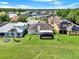 Aerial shot highlighting the expansive, meticulously maintained backyard, complete with a screened lanai at 14036 Cherry Bush Ct, Orlando, FL 32828