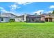 Spacious backyard featuring a screened-in patio, offering a tranquil outdoor living space at 14036 Cherry Bush Ct, Orlando, FL 32828