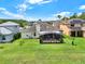 Aerial view of spacious backyard with screened in patio and well-maintained lawn, perfect for outdoor entertaining at 14036 Cherry Bush Ct, Orlando, FL 32828