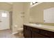 A full bathroom has a vanity, toilet, shower and tub combo, and a mirror at 14036 Cherry Bush Ct, Orlando, FL 32828