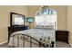 The guest bedroom features a quaint bed, small TV, and window with lots of light at 14036 Cherry Bush Ct, Orlando, FL 32828