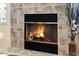 Stone fireplace with glass doors at 14036 Cherry Bush Ct, Orlando, FL 32828