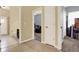 An open hallway leads to the bathroom, living room, and spare bedroom at 14036 Cherry Bush Ct, Orlando, FL 32828