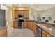 Kitchen with stainless steel appliances, granite countertops, and decorative tile backsplash at 14036 Cherry Bush Ct, Orlando, FL 32828