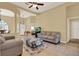 Comfortable living space with tile floors, neutral tones, and views into the dining area and bedroom at 14036 Cherry Bush Ct, Orlando, FL 32828