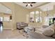 Bright living area featuring tile flooring, neutral paint, and ample space for seating and entertaining at 14036 Cherry Bush Ct, Orlando, FL 32828