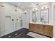 Luxurious bathroom featuring a glass shower, dual vanity, and modern fixtures at 14205 Conifer Dr, Orlando, FL 32832