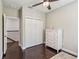 Light-filled bedroom with wood floors, closet and dresser for ample storage at 14205 Conifer Dr, Orlando, FL 32832