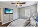 Inviting bedroom with a TV and closet space at 14205 Conifer Dr, Orlando, FL 32832