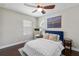 Cozy bedroom with a ceiling fan and a comfortable bed at 14205 Conifer Dr, Orlando, FL 32832