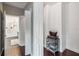 Hallway with dark wood floors leading to a modern bathroom with glass shower at 14205 Conifer Dr, Orlando, FL 32832