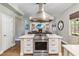 Kitchen island with stainless steel oven and bright views into the living room at 14205 Conifer Dr, Orlando, FL 32832