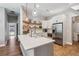 Bright and modern kitchen with white cabinets, a kitchen island, and stainless steel appliances at 14205 Conifer Dr, Orlando, FL 32832