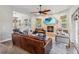 Inviting living room with fireplace, TV, leather sofa, and stylish decor at 14205 Conifer Dr, Orlando, FL 32832