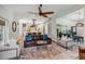 Spacious living room showcasing an open layout with views into the kitchen and dining area at 14205 Conifer Dr, Orlando, FL 32832