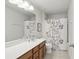 Bathroom featuring vanity, toilet, and shower with floral print curtain at 1450 Chelsea Manor Cir, Deland, FL 32724