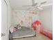 bedroom with a playful floral wallpaper and a colorful play tent at 1450 Chelsea Manor Cir, Deland, FL 32724