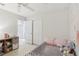 Bright bedroom featuring closet, ceiling fan, and decorative wall art at 1450 Chelsea Manor Cir, Deland, FL 32724