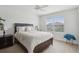 Bedroom featuring ceiling fan, window with blind, and a king bed at 1450 Chelsea Manor Cir, Deland, FL 32724