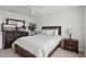 Bedroom featuring ceiling fan, a mirror, and king bed with nightstands at 1450 Chelsea Manor Cir, Deland, FL 32724