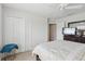 Bedroom featuring ceiling fan, closet, and a king bed with blue throw at 1450 Chelsea Manor Cir, Deland, FL 32724