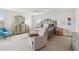 Bedroom featuring ceiling fan, king bed with nightstands, recliner, and dresser at 1450 Chelsea Manor Cir, Deland, FL 32724