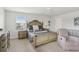 Bedroom featuring ceiling fan, king bed with nightstands, and a large dresser at 1450 Chelsea Manor Cir, Deland, FL 32724