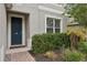 Close up of the front door, small garden and beautiful landscaping at 1450 Chelsea Manor Cir, Deland, FL 32724