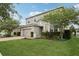 Charming two-story home with a brick driveway, manicured lawn and side yard at 1450 Chelsea Manor Cir, Deland, FL 32724