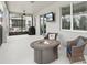 Covered patio with fire pit, comfortable seating, and ceiling fan at 1450 Chelsea Manor Cir, Deland, FL 32724