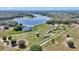 Picturesque aerial view of the home nestled on expansive grounds, near the tranquil lake at 16386 Se 156Th Place Rd, Weirsdale, FL 32195