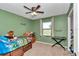 Bedroom with ample space, closet and ceiling fan at 16386 Se 156Th Place Rd, Weirsdale, FL 32195