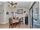 Bright dining area with table and chairs and sliding glass doors to the outside, perfect for casual meals and gatherings at 16386 Se 156Th Place Rd, Weirsdale, FL 32195