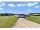 Inviting single story home with lake view and driveway at 16386 Se 156Th Place Rd, Weirsdale, FL 32195